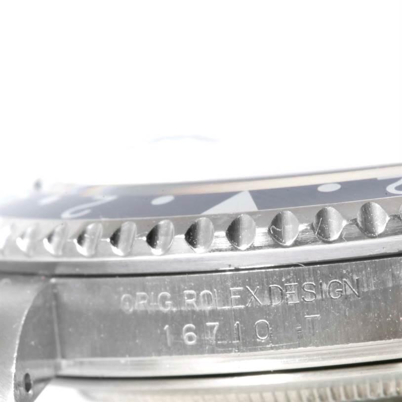 The image shows a close-up, side-view angle of the bezel and case of a Rolex GMT-Master 16710 Men's Stainless Steel Black Dial 16710 Men's Stainless Steel Black Dial model, displaying the engraved model number "16710".