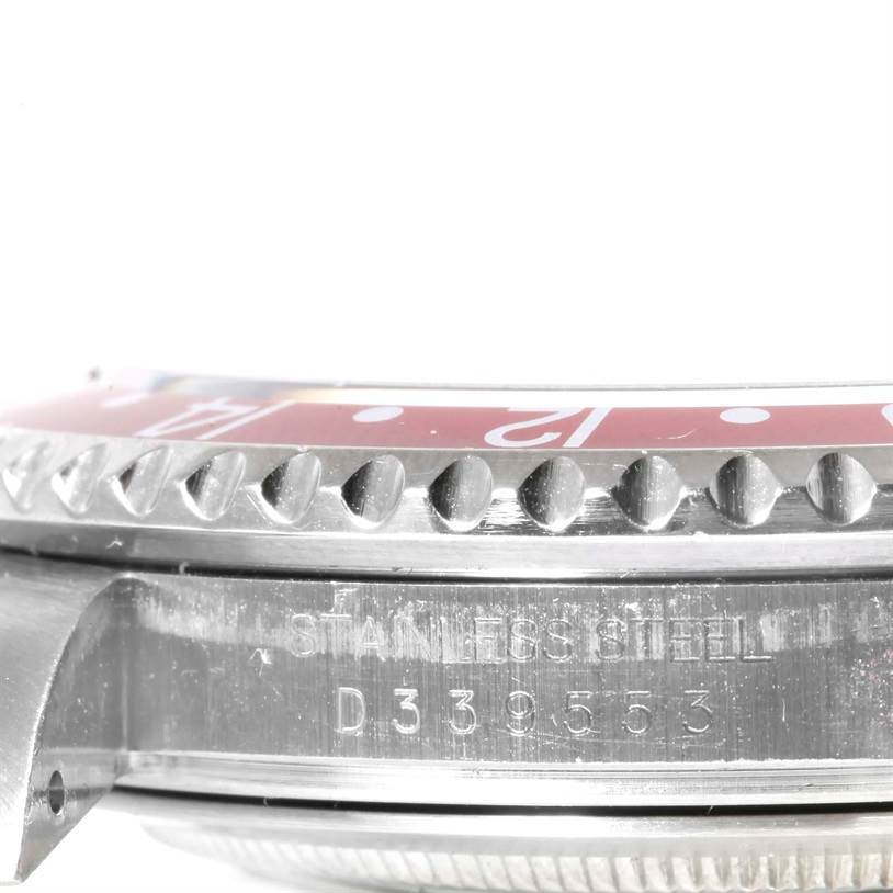 This close-up image shows the bezel and part of the stainless steel case of a Rolex GMT-Master 16710 Men's Stainless Steel Black Dial 16710 Men's Stainless Steel Black Dial watch.