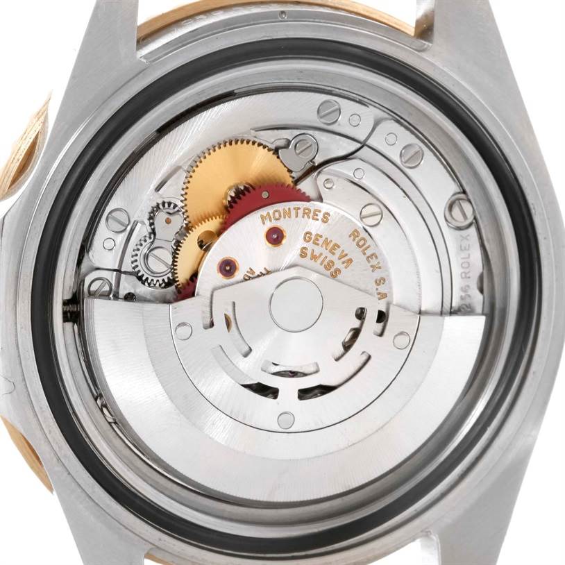 The image shows the back view of a Rolex GMT-Master 16713 Men
s Stainless Steel Black Dial 16713 Men
s Stainless Steel Black Dial watch, displaying the internal movement mechanism and gears.