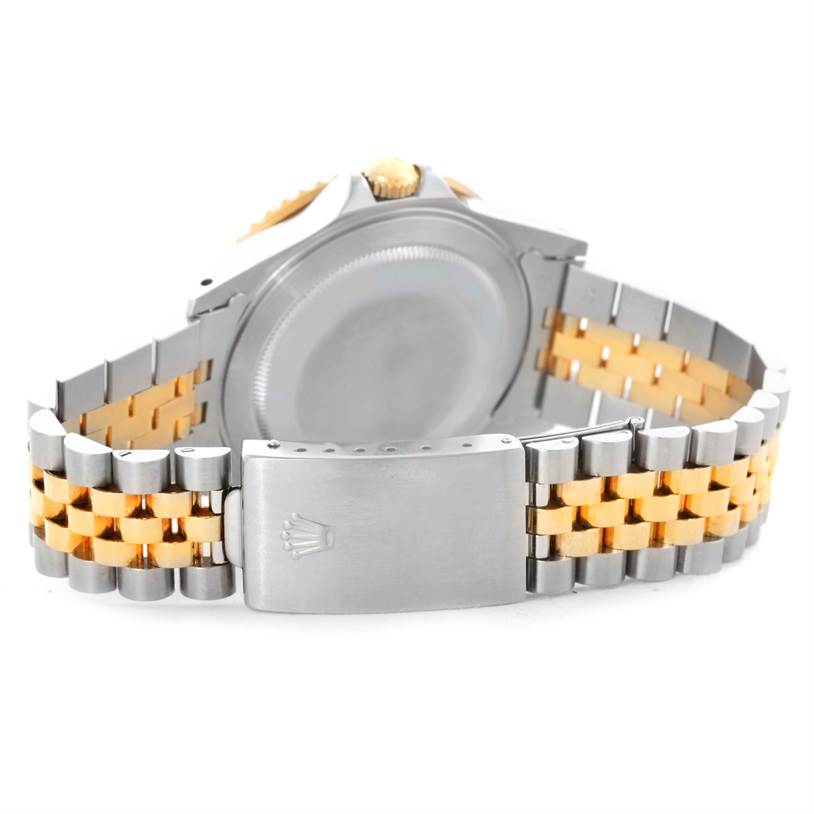 The image shows the back case and two-tone bracelet of the Rolex GMT-Master 16713 Men
s Stainless Steel Black Dial 16713 Men
s Stainless Steel Black Dial watch.