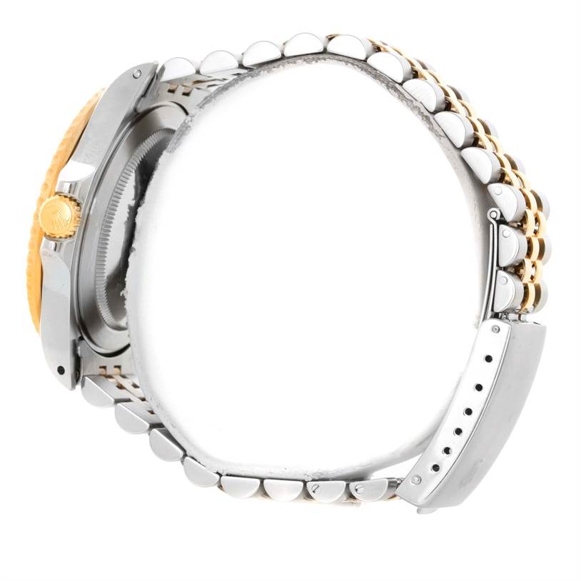 The image shows a side view of a Rolex GMT-Master 16713 Men
s Stainless Steel Black Dial 16713 Men
s Stainless Steel Black Dial watch, highlighting the crown, case, and two-tone bracelet.