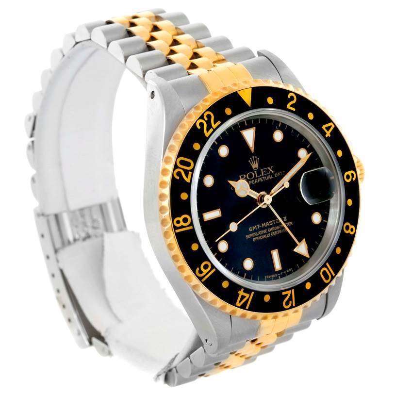 The image shows a Rolex GMT-Master 16713 Men
s Stainless Steel Black Dial 16713 Men
s Stainless Steel Black Dial watch angled from the front left, highlighting its bezel, dial, and two-tone bracelet.