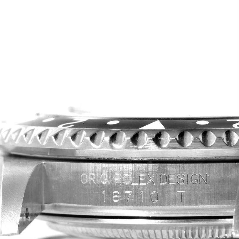 The image shows a close-up side view of the bezel and case of a GMT-Master model Rolex watch.