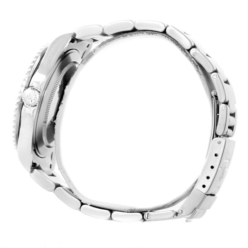 A side profile of a Rolex GMT-Master 16710 Men's Stainless Steel Black Dial 16710 Men's Stainless Steel Black Dial watch showcasing its crown, bezel, case, and bracelet with clasp.