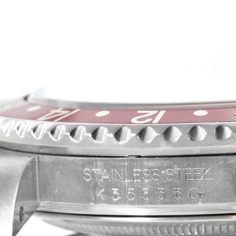 Side view of the stainless steel bezel and case, showing the serial number of a Rolex GMT-Master 16710 Men's Stainless Steel Black Dial 16710 Men's Stainless Steel Black Dial.