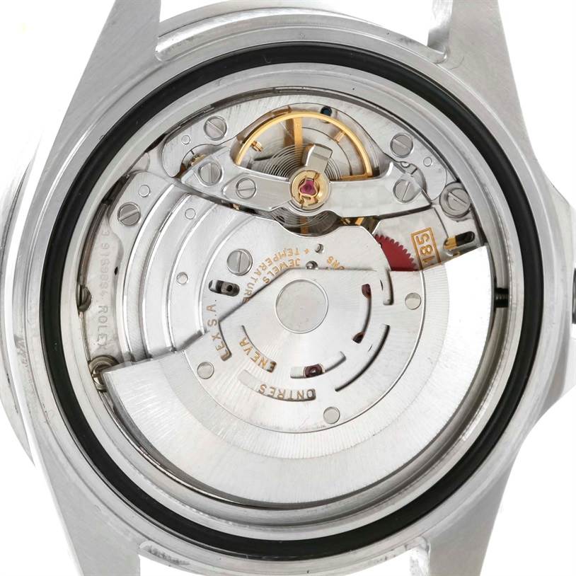 This is an open view of the Rolex GMT-Master 16710 Men's Stainless Steel Black Dial 16710 Men's Stainless Steel Black Dial watch's movement mechanism showing intricate internal parts.