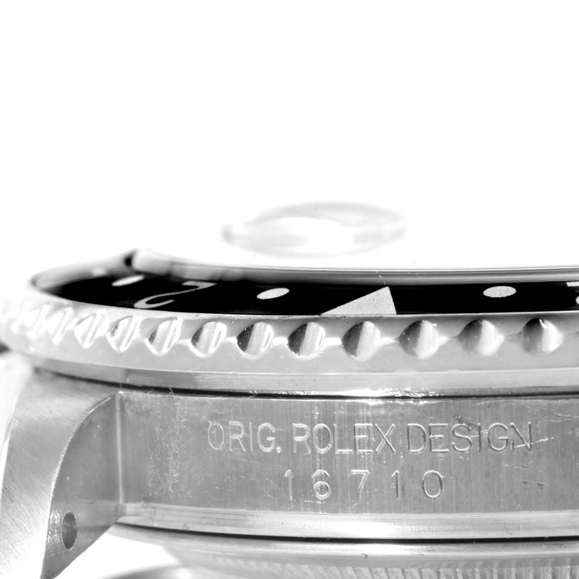 This close-up shot of the Rolex GMT-Master 16710 Men's Stainless Steel Black Dial 16710 Men's Stainless Steel Black Dial shows the watch's side and bezel with "Orig. Rolex Design 16710" engraved.