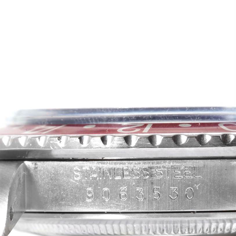 The image shows a side view of the bezel and case side, including the serial number, of a Rolex GMT-Master 16750 Men's Stainless Steel Black Dial 16750 Men's Stainless Steel Black Dial watch.