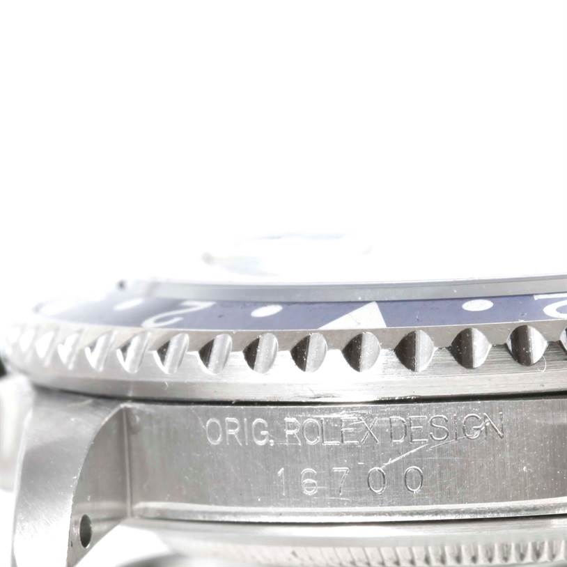 The image shows a close-up side angle of the bezel and engraving on the case of a Rolex GMT-Master 16700 Men
s Stainless Steel Black Dial 16700 Men
s Stainless Steel Black Dial model.