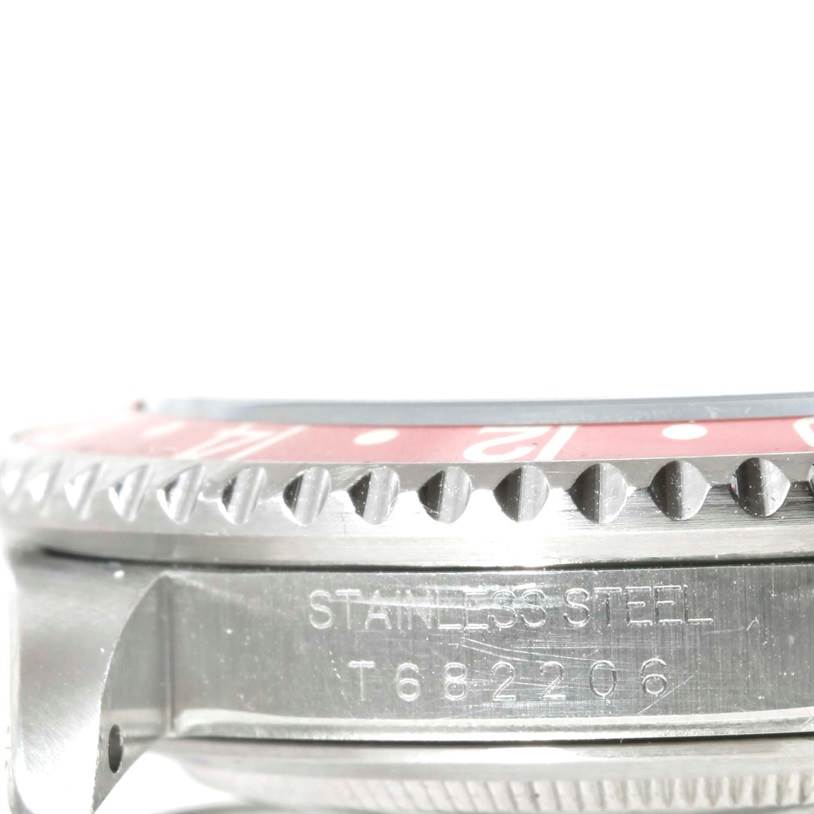This image shows a close-up of the bezel and side case of a Rolex GMT-Master 16700 Men
s Stainless Steel Black Dial 16700 Men
s Stainless Steel Black Dial watch made of stainless steel.