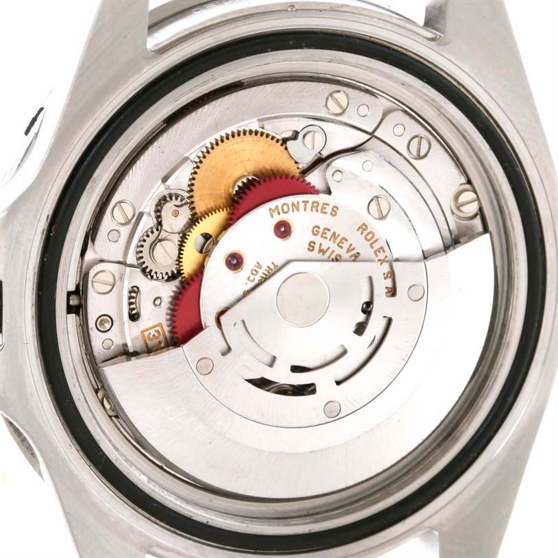 The image shows the back case opened, revealing the internal movement mechanism of the Rolex GMT-Master 16700 Men
s Stainless Steel Black Dial 16700 Men
s Stainless Steel Black Dial watch.