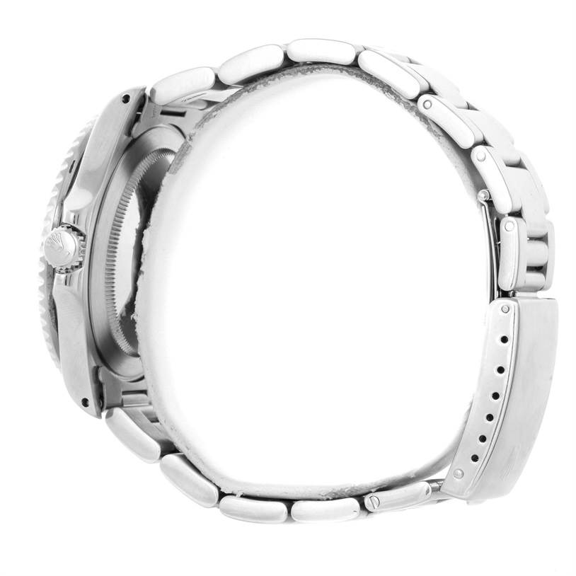 This image shows a side view of a Rolex GMT-Master 16700 Men
s Stainless Steel Black Dial 16700 Men
s Stainless Steel Black Dial watch focusing on the crown, case, and bracelet.