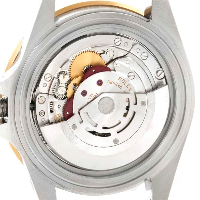 The image shows the open case back of a Rolex GMT-Master 16713 Men's Stainless Steel Black Dial 16713 Men's Stainless Steel Black Dial, revealing its internal movement and components.