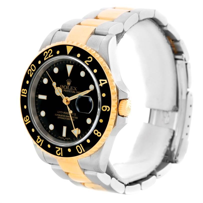 The Rolex GMT-Master 16713 Men's Stainless Steel Black Dial 16713 Men's Stainless Steel Black Dial watch is shown at a three-quarter angle highlighting the bezel, black dial, and two-tone bracelet.