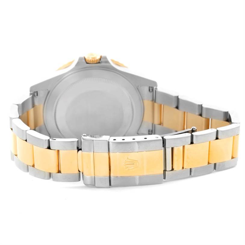 The image shows the back and clasp of a Rolex GMT-Master 16713 Men's Stainless Steel Black Dial 16713 Men's Stainless Steel Black Dial watch, featuring a two-tone metal bracelet.