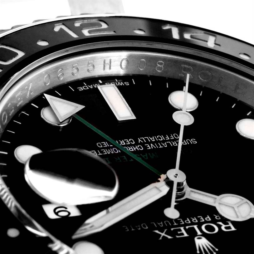 This close-up angle of the Rolex GMT-Master 116710 Men's Stainless Steel Black Dial 116710 Men's Stainless Steel Black Dial shows the dial, hands, and part of the bezel with 12 and 14 digits.
