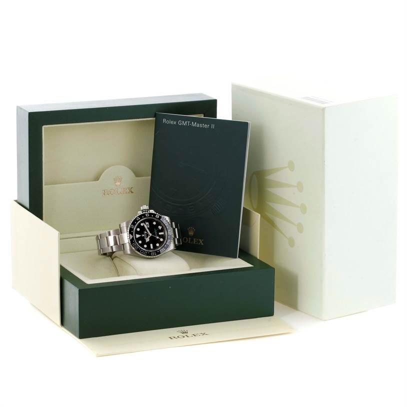 The image shows a Rolex GMT-Master 116710 Men's Stainless Steel Black Dial 116710 Men's Stainless Steel Black Dial II watch placed inside its open box with an accompanying booklet.