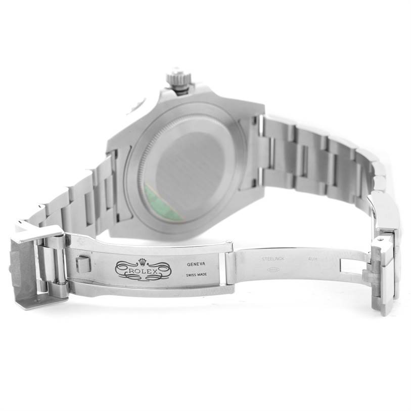 The image shows the underside of a Rolex GMT-Master 116710 Men's Stainless Steel Black Dial 116710 Men's Stainless Steel Black Dial watch, focusing on the open clasp and the case back.