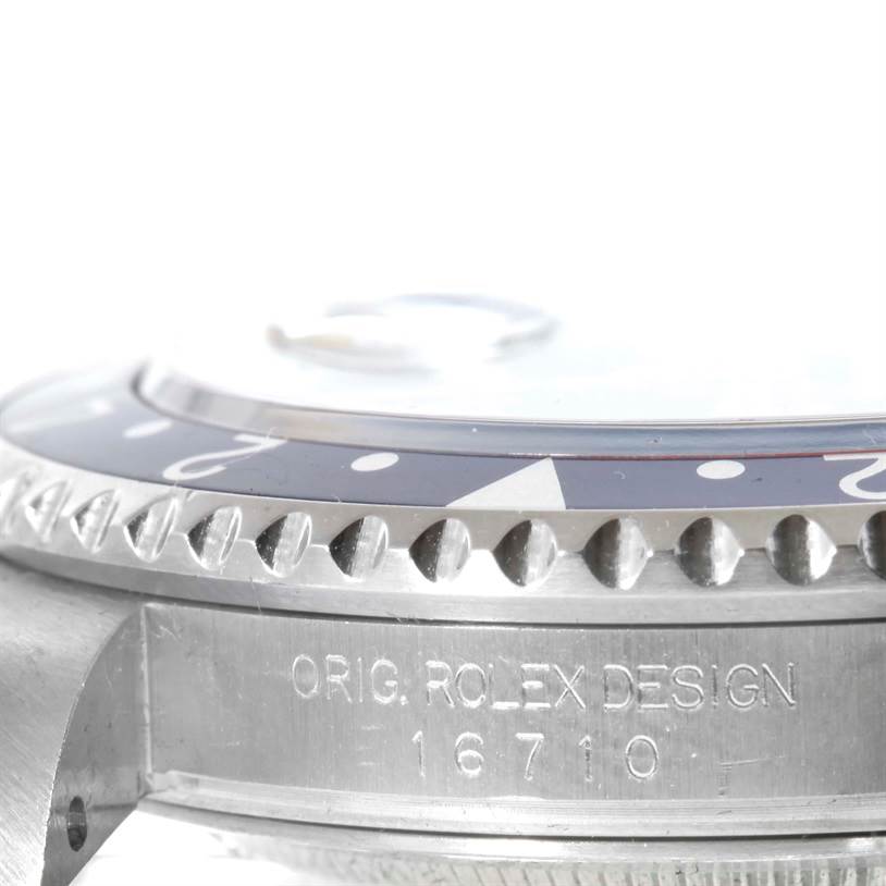 This image shows a close-up, angled view of the Rolex GMT-Master 16710 Men
s Stainless Steel Black Dial 16710 Men
s Stainless Steel Black Dial watch
s side, highlighting the bezel and model number "16710".