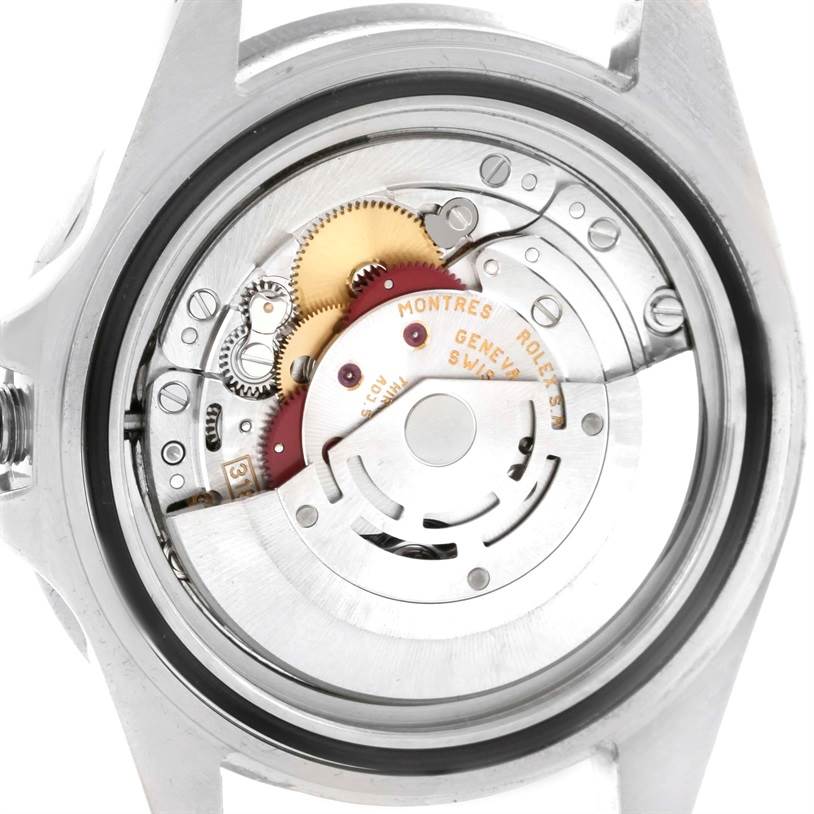 The image shows the back of a Rolex GMT-Master 16710 Men
s Stainless Steel Black Dial 16710 Men
s Stainless Steel Black Dial watch, revealing its internal movement components like gears and the rotor.