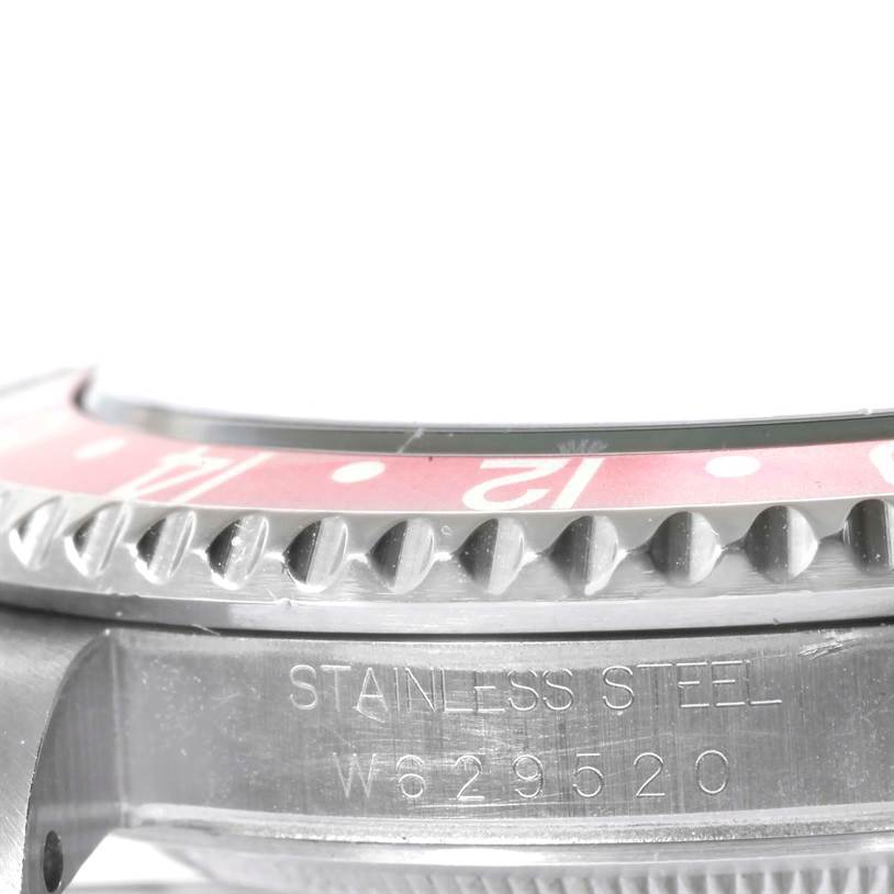 This side-angle close-up shows the bezel and case of a stainless steel Rolex GMT-Master 16700 Men's Stainless Steel Black Dial 16700 Men's Stainless Steel Black Dial watch.