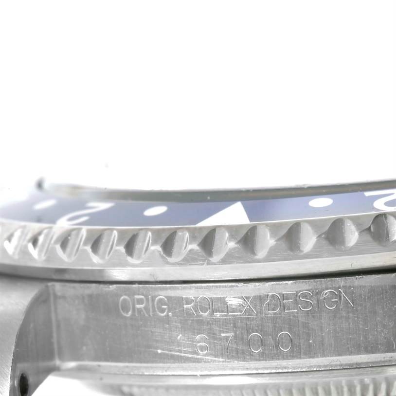 This close-up angle of the Rolex GMT-Master 16700 Men's Stainless Steel Black Dial 16700 Men's Stainless Steel Black Dial shows the side of the bezel and the engraved case.
