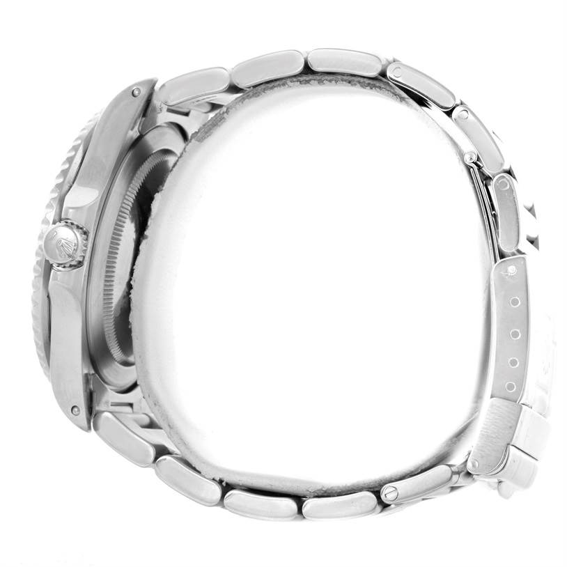 The image shows a side view of a Rolex GMT-Master 16700 Men's Stainless Steel Black Dial 16700 Men's Stainless Steel Black Dial watch, highlighting the bracelet and the crown.