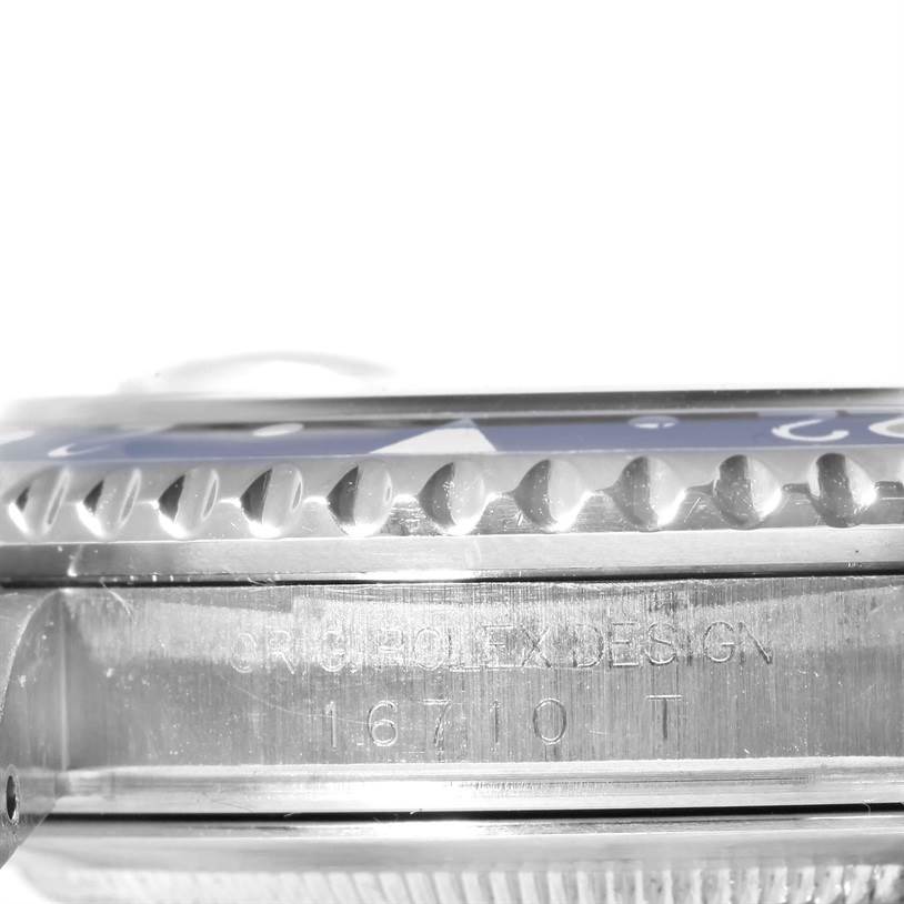 This image shows a side view of the case and bezel of a Rolex GMT-Master 16710 Men's Stainless Steel Black Dial 16710 Men's Stainless Steel Black Dial model, showcasing the model number "16710 T".