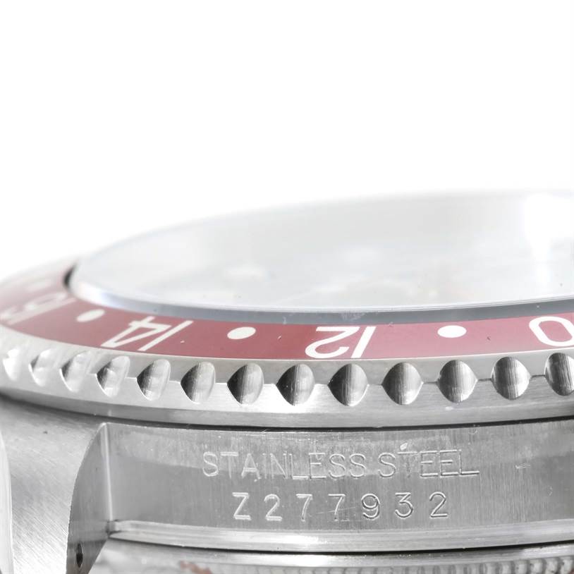 This image shows a close-up of the stainless steel case, bezel, and part of the crystal of a Rolex GMT-Master 16710 Men's Stainless Steel Black Dial 16710 Men's Stainless Steel Black Dial watch.