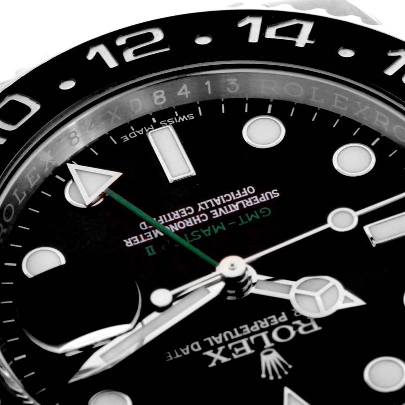 This close-up image shows the dial, hands, and partial bezel of the Rolex GMT-Master 116710 Men's Stainless Steel Black Dial 116710 Men's Stainless Steel Black Dial watch.