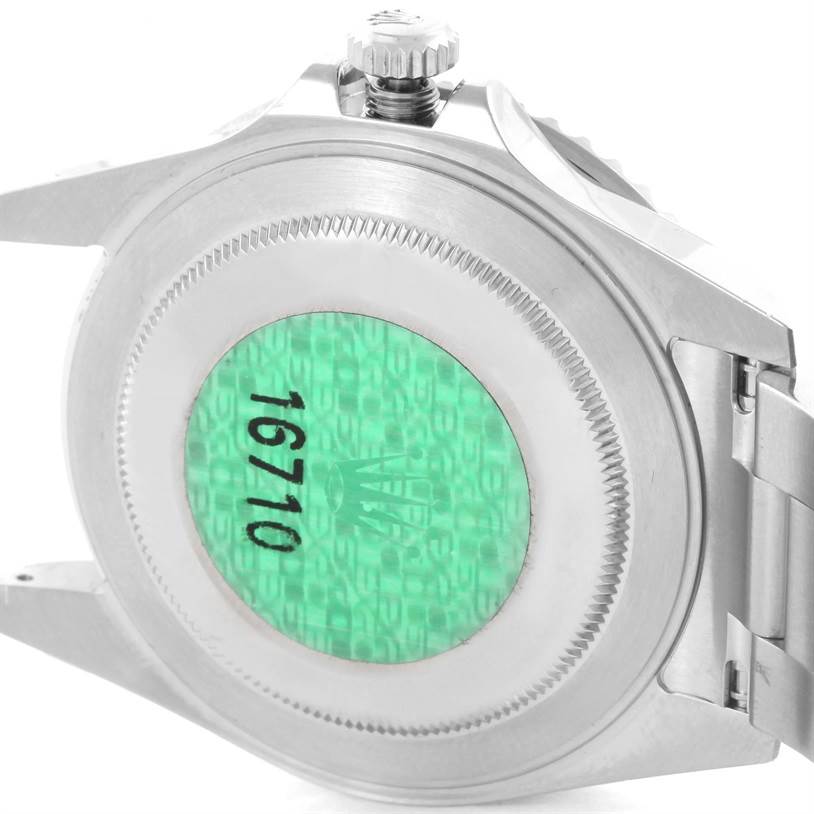 The image shows the back case and part of the bracelet of a Rolex GMT-Master 16710 Men's Stainless Steel Black Dial 16710 Men's Stainless Steel Black Dial watch.