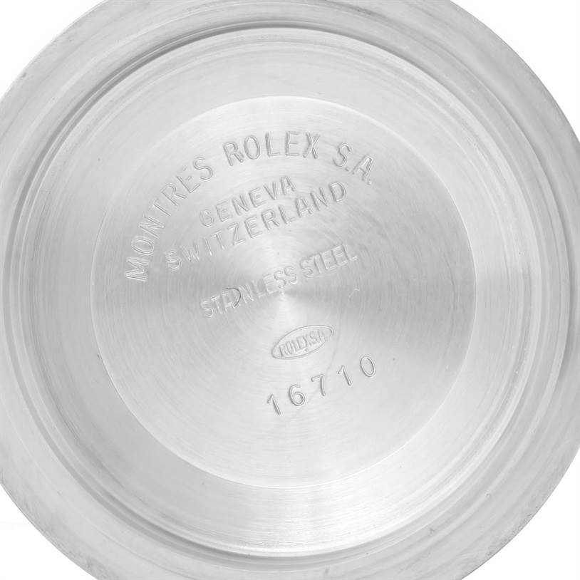 This image shows the inside of the case back for a Rolex GMT-Master 16713 Men
s Stainless Steel Black Dial 16713 Men
s Stainless Steel Black Dial model watch, featuring engravings with brand and model details.