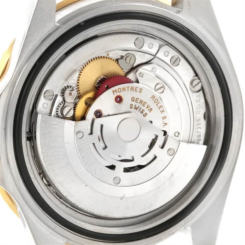 This image shows the movement and internal mechanism components of a Rolex GMT-Master 16713 Men
s Stainless Steel Black Dial 16713 Men
s Stainless Steel Black Dial watch from a rear angle.