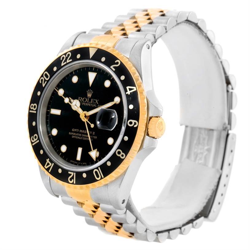 The image shows a Rolex GMT-Master 16713 Men
s Stainless Steel Black Dial 16713 Men
s Stainless Steel Black Dial watch at a three-quarter angle highlighting its bezel, dial, crown, and bracelet.