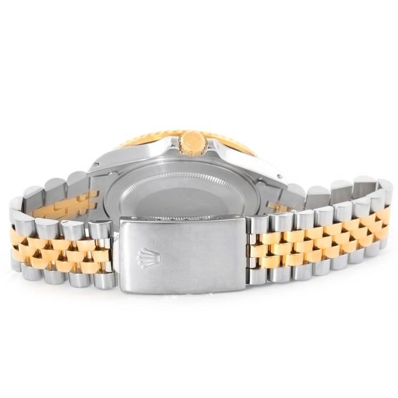 The image shows the back and clasp of a Rolex GMT-Master 16713 Men
s Stainless Steel Black Dial 16713 Men
s Stainless Steel Black Dial watch, highlighting the bi-color bracelet and crown.