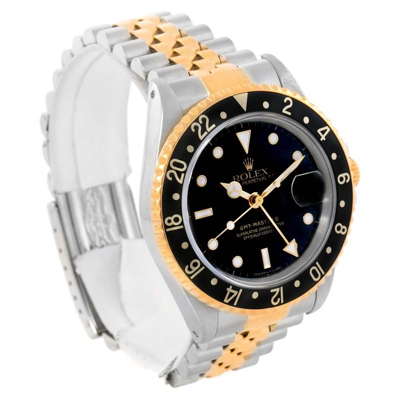 This image shows a side angle of the Rolex GMT-Master 16713 Men
s Stainless Steel Black Dial 16713 Men
s Stainless Steel Black Dial with its bezel, dial, and two-tone bracelet clearly visible.