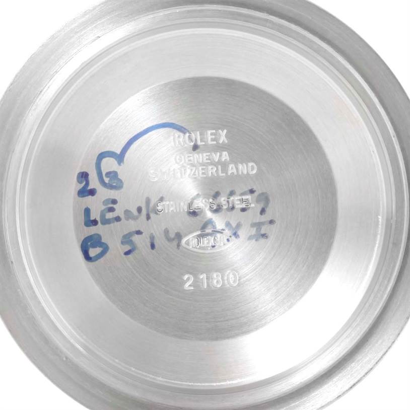 This image shows the inner side of the case back of a Rolex GMT-Master 16710 Men's Stainless Steel Black Dial 16710 Men's Stainless Steel Black Dial, displaying engravings and handwritten markings.