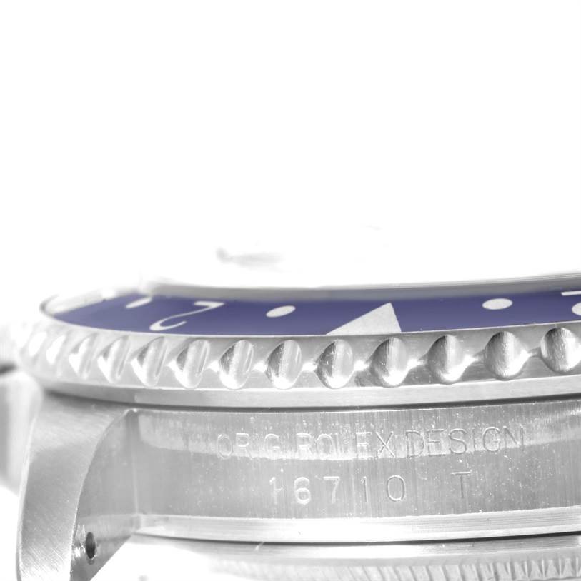 This close-up image shows the side view of the bezel, case, and engraving of a Rolex GMT-Master 16710 Men's Stainless Steel Black Dial 16710 Men's Stainless Steel Black Dial watch.