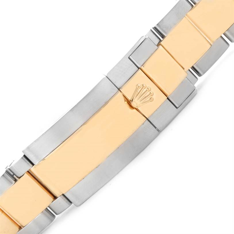 This image shows a close-up angle of the Rolex GMT-Master 116713LN Men's Stainless Steel Black Dial 116713LN Men's Stainless Steel Black Dial bracelet clasp, featuring a combination of gold and stainless steel.