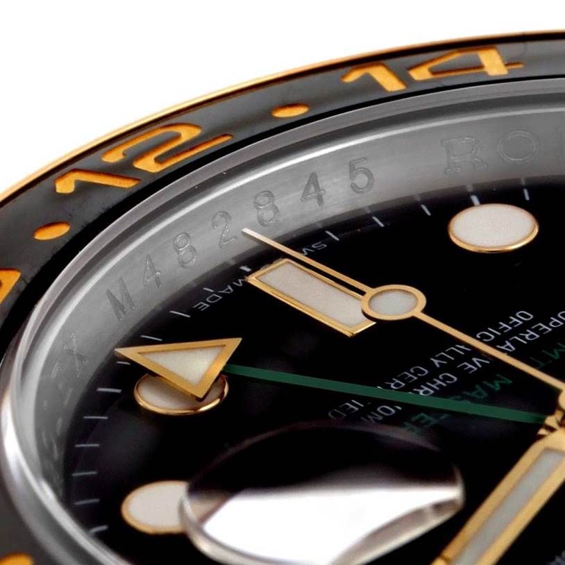 Close-up side angle of the Rolex GMT-Master 116713LN Men's Stainless Steel Black Dial 116713LN Men's Stainless Steel Black Dial watch showing partial bezel, dial, and hands.