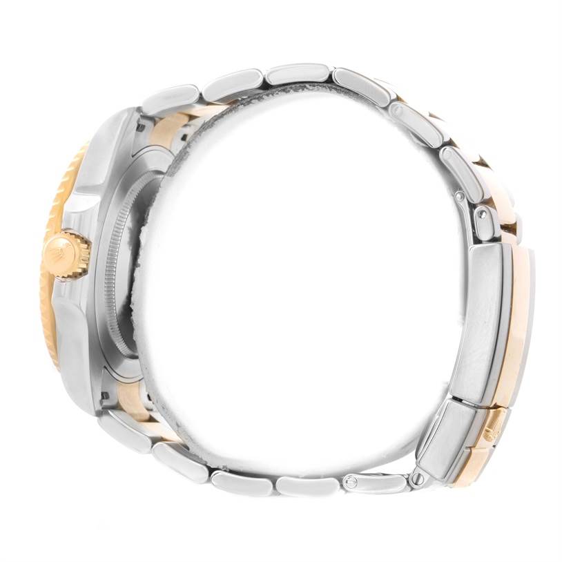 The side profile of a Rolex GMT-Master 116713LN Men's Stainless Steel Black Dial 116713LN Men's Stainless Steel Black Dial watch shows the crown, bezel, and part of the bracelet.