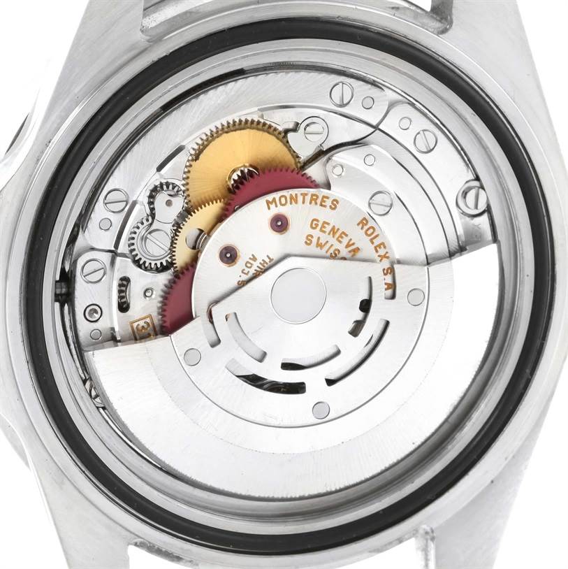 The image shows the internal mechanics and movement of a Rolex GMT-Master 16710 Men's Stainless Steel Black Dial 16710 Men's Stainless Steel Black Dial watch from a back angle.