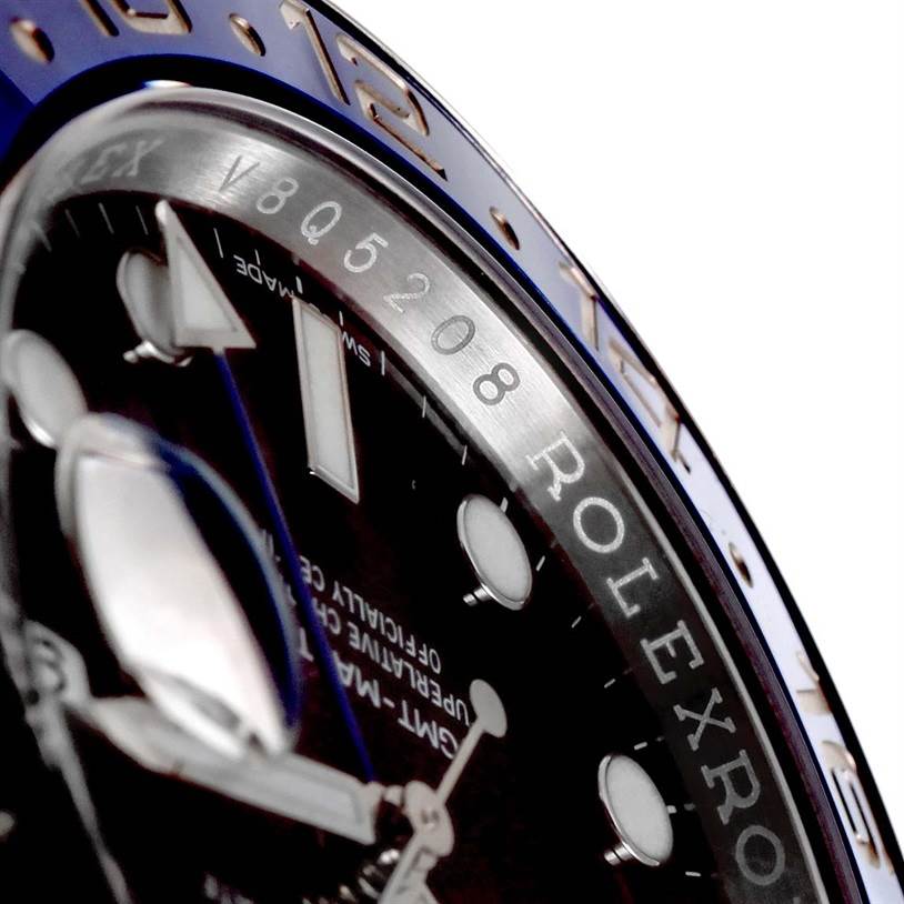 The image shows a close-up angle of the Rolex GMT-Master 116710BLNR Men's Stainless Steel Black Dial 116710BLNR Men's Stainless Steel Black Dial watch, highlighting the bezel, part of the dial, and hour markers.