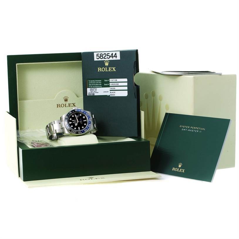 This image shows a Rolex GMT-Master 116710BLNR Men's Stainless Steel Black Dial 116710BLNR Men's Stainless Steel Black Dial watch, its box, warranty card, and manual from a front angle.