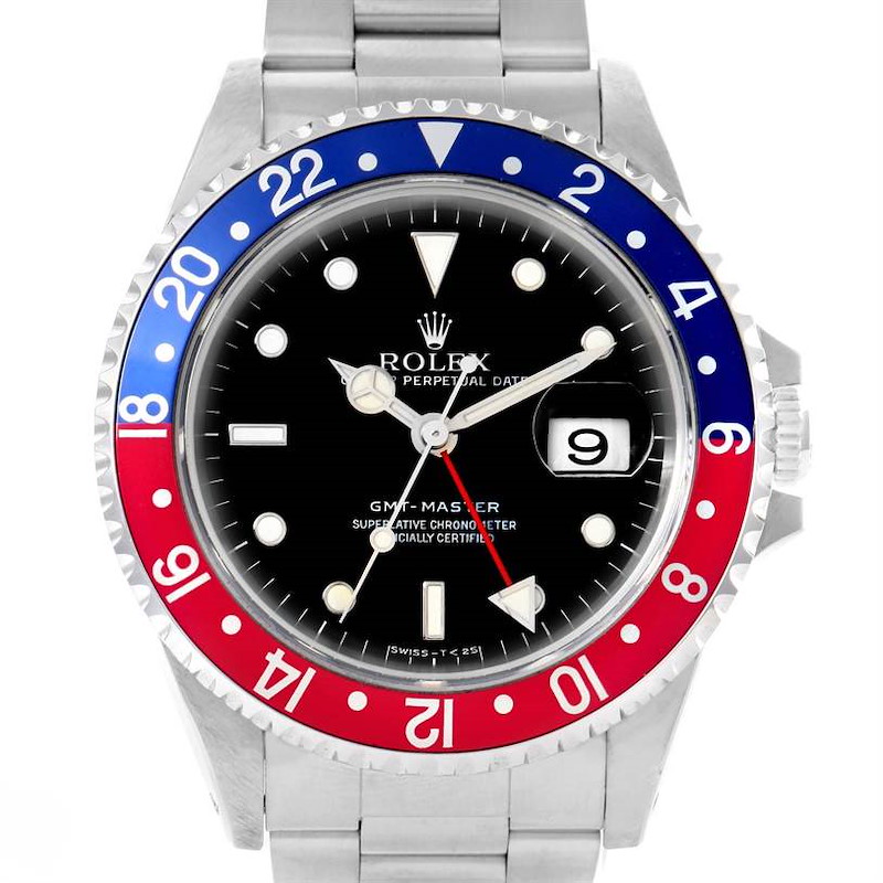 The image shows a frontal view of the Rolex GMT-Master watch, highlighting its black dial, red-blue bezel, and stainless steel bracelet.