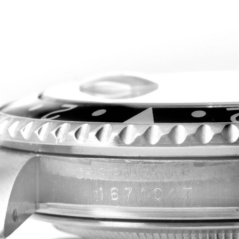 This image shows a close-up side view of the Rolex GMT-Master 16710 Men's Stainless Steel Black Dial 16710 Men's Stainless Steel Black Dial bezel and part of the case with the model number 16710.