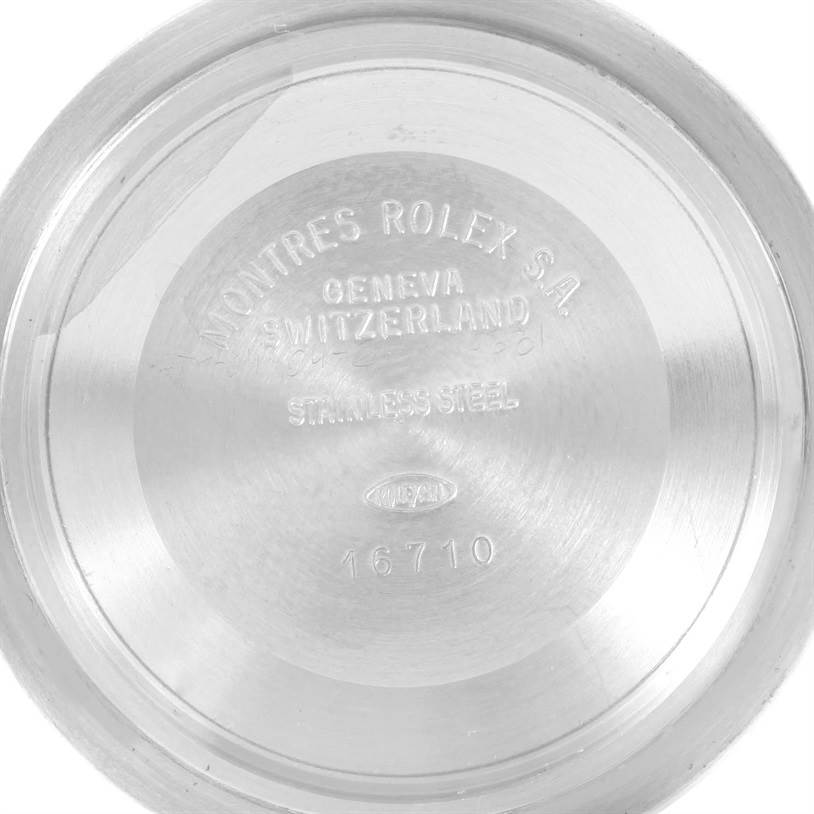 This is the back casing of a Rolex GMT-Master 16710 Men's Stainless Steel Black Dial 16710 Men's Stainless Steel Black Dial watch, showing the inscriptions and model number 16710 on the inner side.