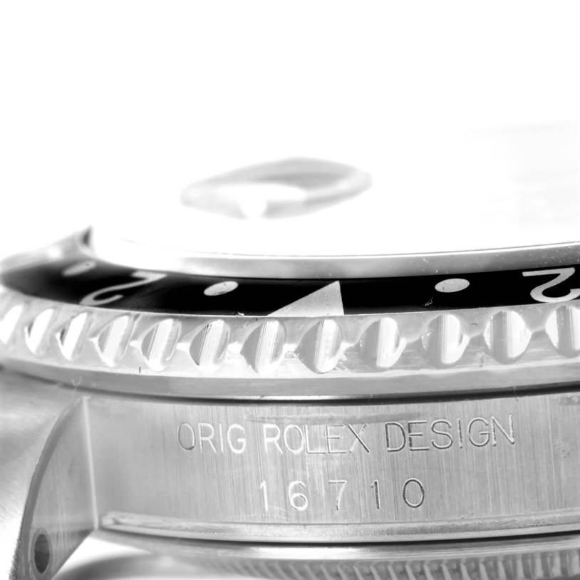 The image shows a close-up side view of the bezel and case of the Rolex GMT-Master 16710 Men's Stainless Steel Black Dial 16710 Men's Stainless Steel Black Dial model, with "ORIG ROLEX DESIGN 16710" engraved.