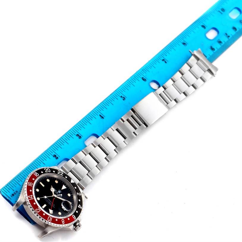 The image shows a top-down view of a Rolex GMT-Master 16710 Men's Stainless Steel Black Dial 16710 Men's Stainless Steel Black Dial watch, focusing on the bracelet, clasp, and part of the bezel.