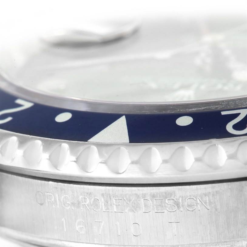 This close-up angle shows a portion of the bezel and case of the Rolex GMT-Master 16710 Men's Stainless Steel Black Dial 16710 Men's Stainless Steel Black Dial, highlighting the model number 16710.